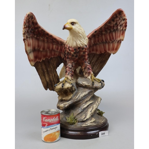 380 - Large Eagle figure on wooden plinth - Approx height 47cm