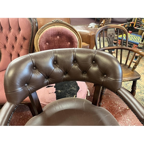 519 - Leather swivel armchair