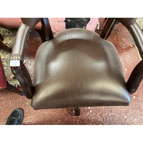 519 - Leather swivel armchair