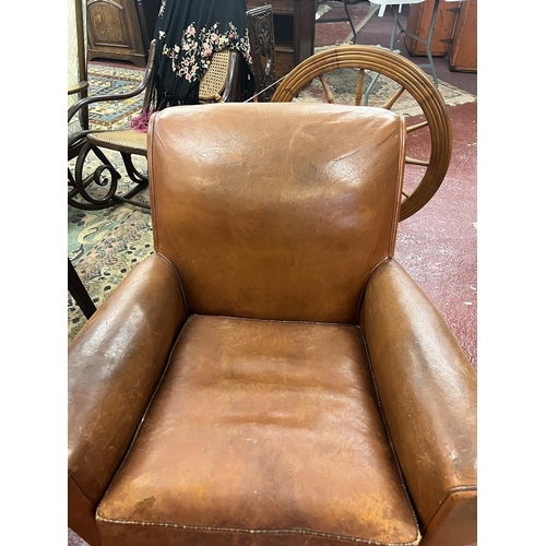 525 - Antique tan leather armchair