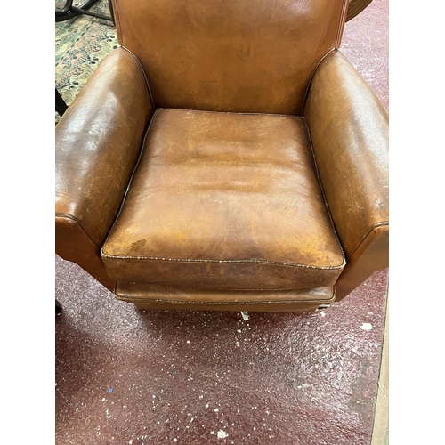 525 - Antique tan leather armchair