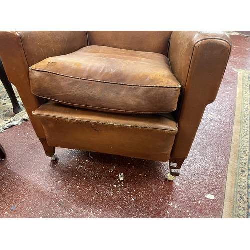 525 - Antique tan leather armchair