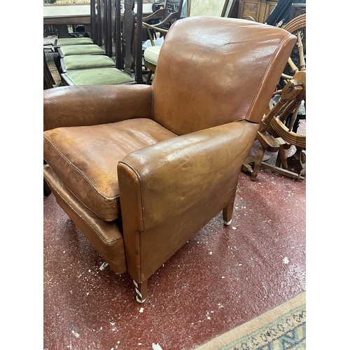 525 - Antique tan leather armchair