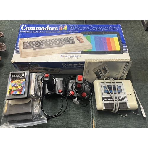 216 - Commadore 64 Micro Computer in original box together with games, controllers etc