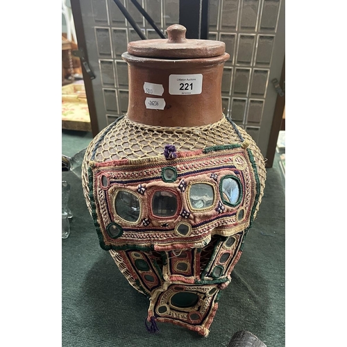 221 - Lidded terracotta pot with cane wrap together with a Jordanian woman's mask