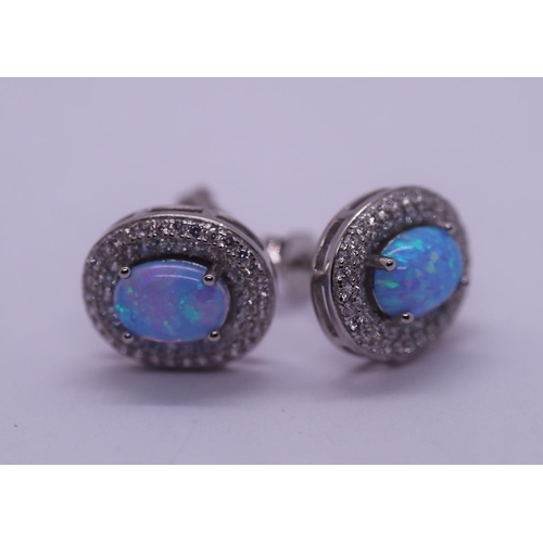 25 - Pair of silver opal set earrings