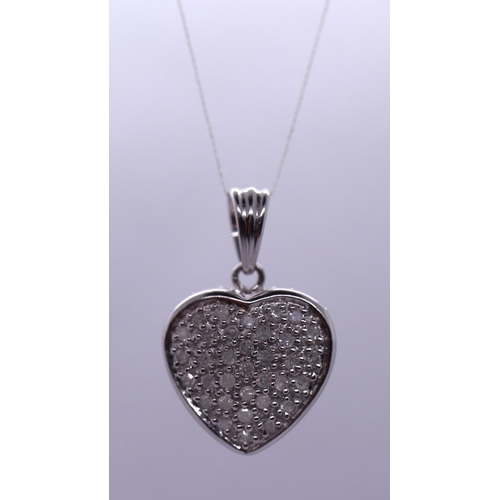 26 - 9ct white gold diamond set heart pendent