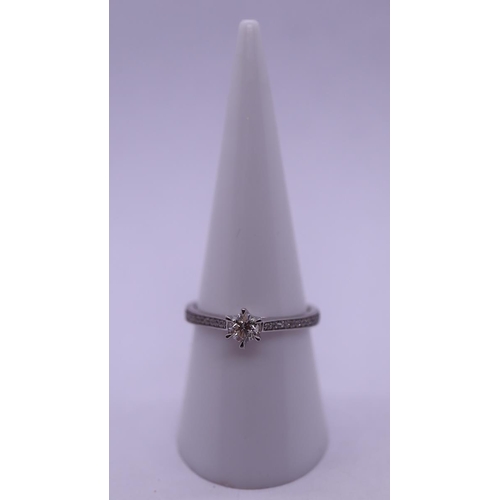 32 - 9ct white gold diamond solitaire ring with diamond shoulders - Size O