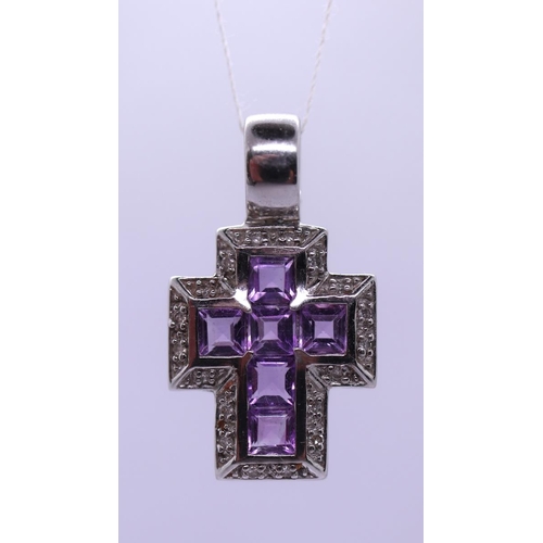 33 - 9ct white gold diamond & amethyst set cross