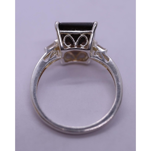 21 - Silver topaz set ring - Size T