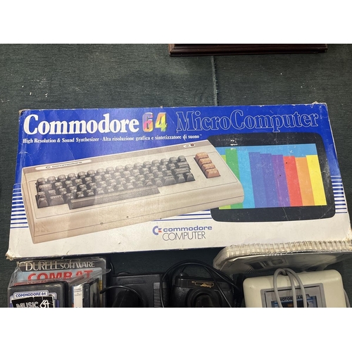 216 - Commadore 64 Micro Computer in original box together with games, controllers etc