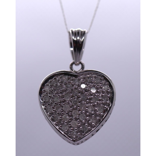 26 - 9ct white gold diamond set heart pendent