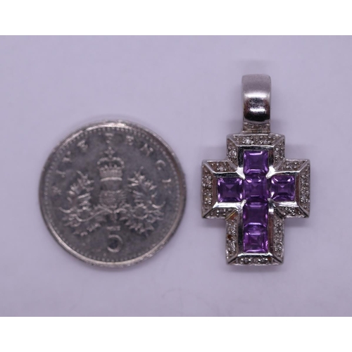 33 - 9ct white gold diamond & amethyst set cross