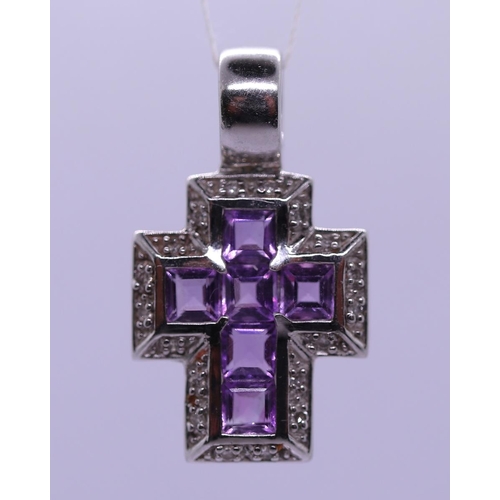 33 - 9ct white gold diamond & amethyst set cross