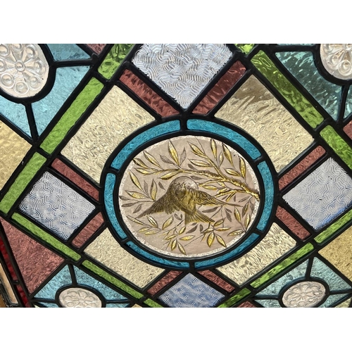 357 - Pair of stained glass windows - Both approx 55cm x 58cm