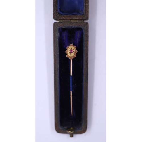 42 - 9ct gold stick pin set with a ruby