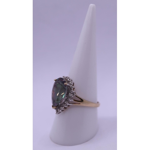 56 - 9ct gold mystic topaz & diamond set ring - Size R