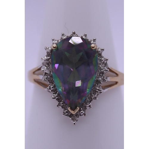 56 - 9ct gold mystic topaz & diamond set ring - Size R