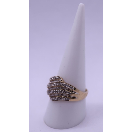 76 - 9ct gold diamond set ring - Weight: 4.3g - Size S