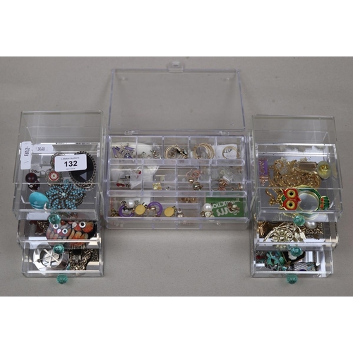 132 - Collection of costume jewellery in acrylic drawers to include silver