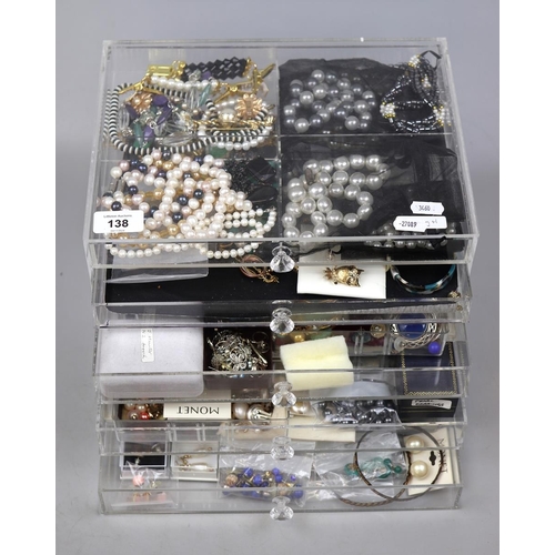 138 - Collection of costume jewelley in acrylic drawers to include silver