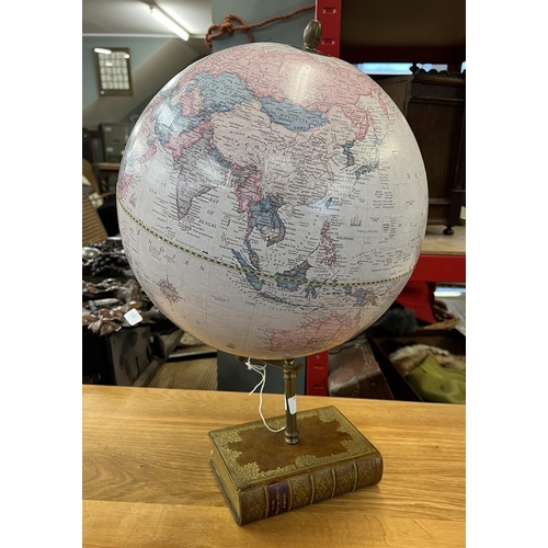 320 - Globe on book plinth