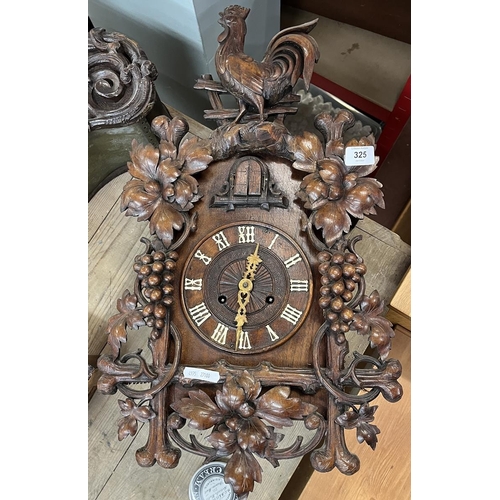 325 - Spring driven Cuckoo clock with carved vine decoration