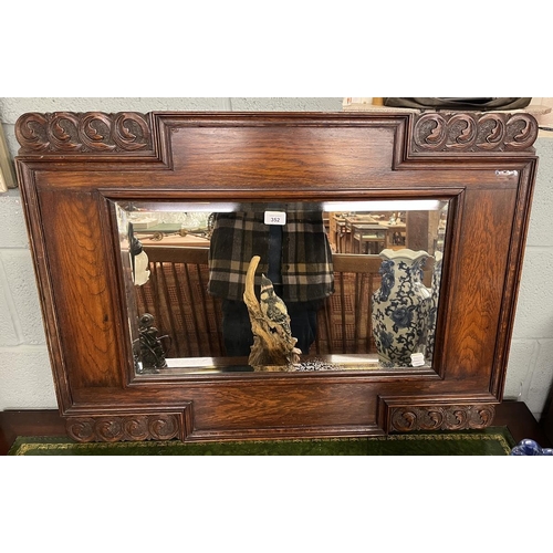 352 - Early 20thC carved oak framed bevelled glass mirror