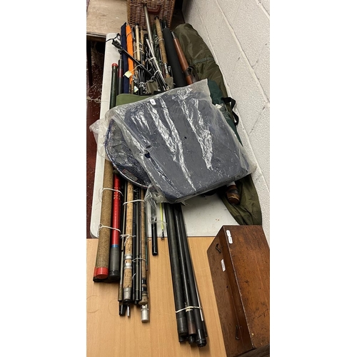 392 - Good collection of fishing rods and equipment to include match rods, landing nets and tents etc