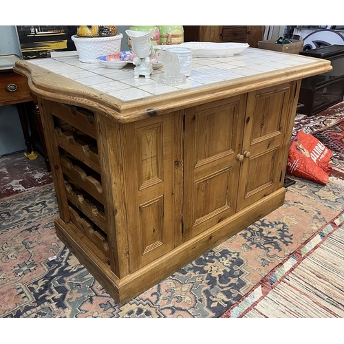 476 - Tile topped pine kitchen island with cupboards and wine rack to base