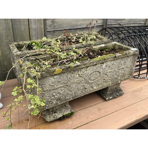 570 - Pair of stone trough planters on plinths