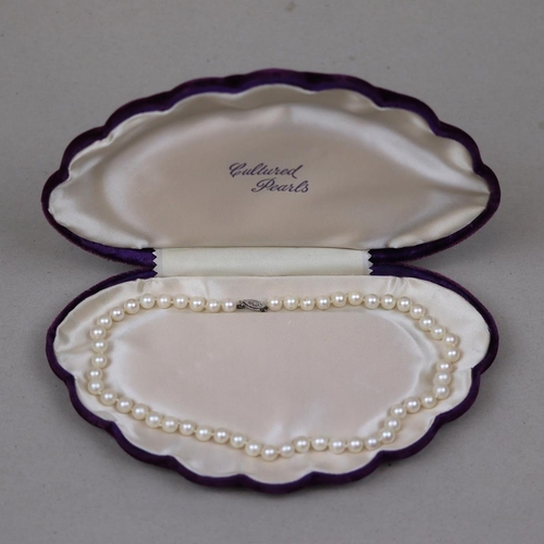 127 - String of cultured pearls in original box