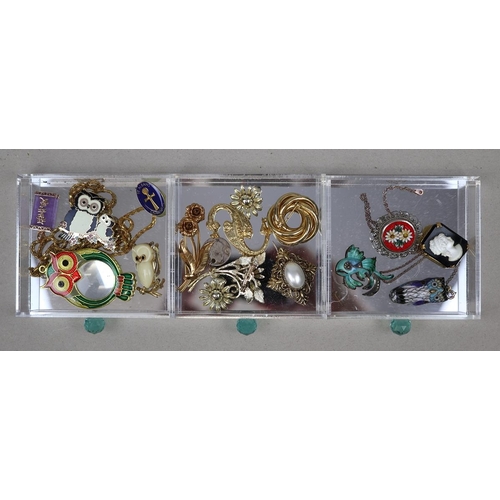 132 - Collection of costume jewellery in acrylic drawers to include silver