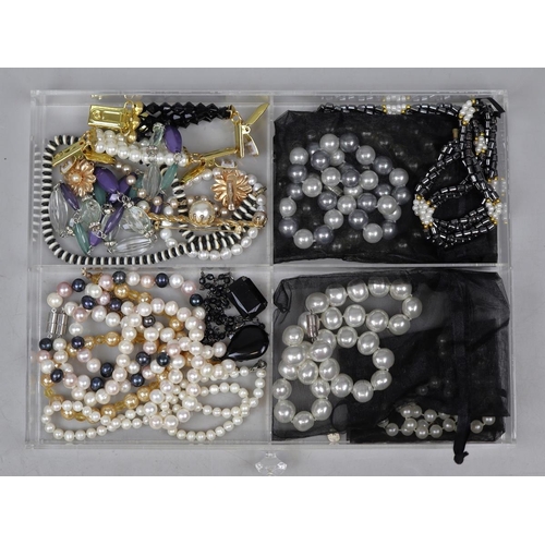 138 - Collection of costume jewelley in acrylic drawers to include silver