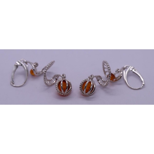 22 - Pair of silver and amber set earrings