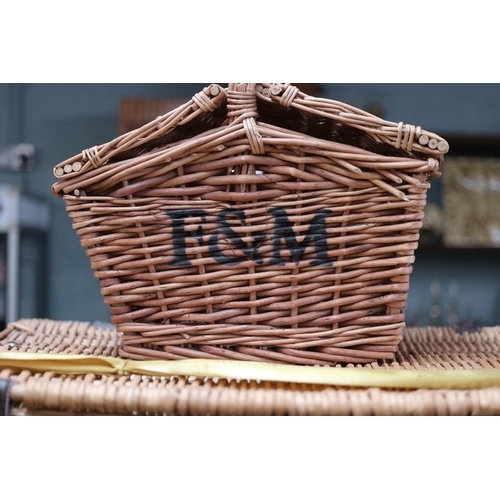 307 - 2 wicker baskets F&M and Regency Hampers