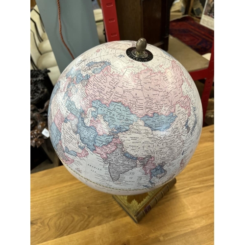 320 - Globe on book plinth