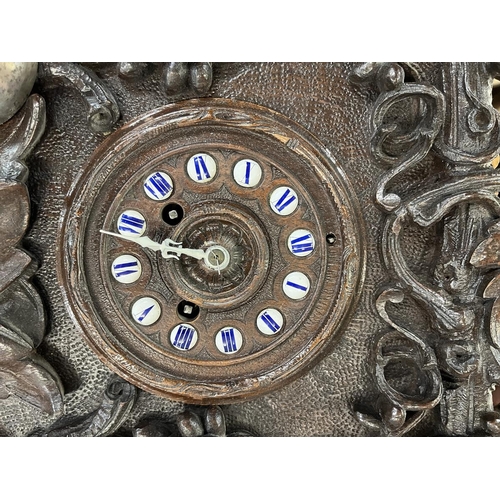 324 - Carved mantle clock with French movement