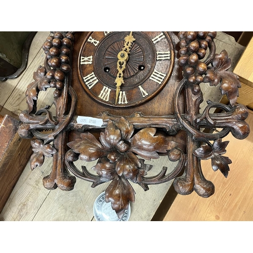 325 - Spring driven Cuckoo clock with carved vine decoration