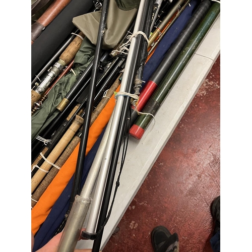 392 - Good collection of fishing rods and equipment to include match rods, landing nets and tents etc