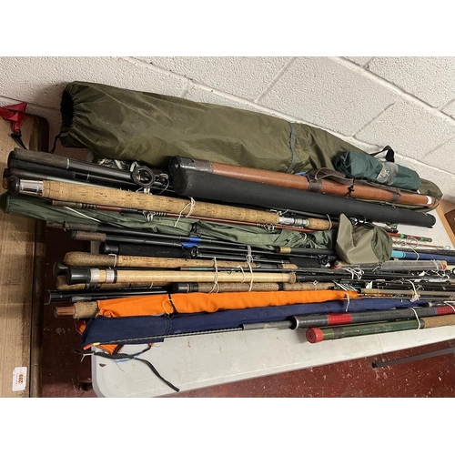 392 - Good collection of fishing rods and equipment to include match rods, landing nets and tents etc