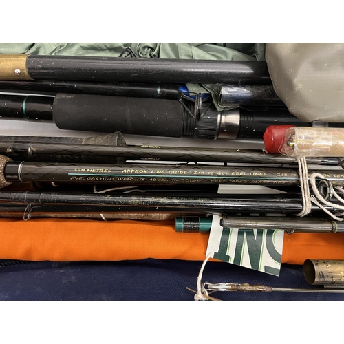 392 - Good collection of fishing rods and equipment to include match rods, landing nets and tents etc