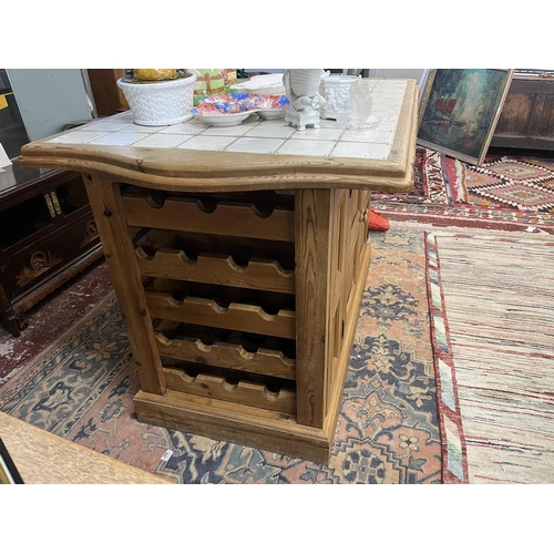 476 - Tile topped pine kitchen island with cupboards and wine rack to base