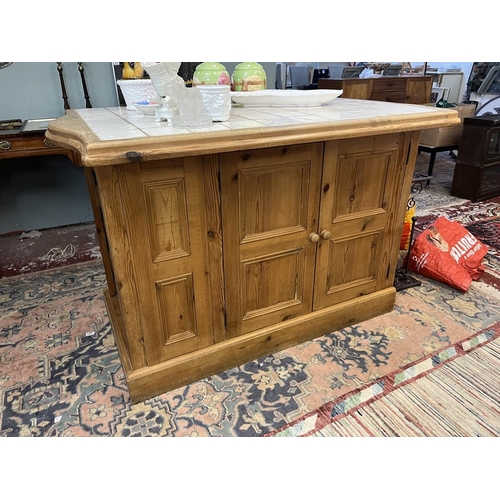 476 - Tile topped pine kitchen island with cupboards and wine rack to base