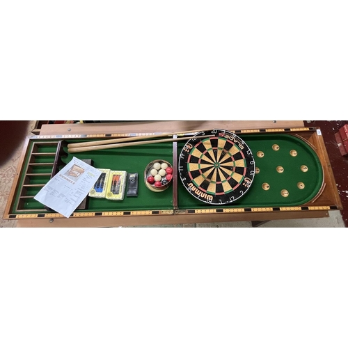 144 - Collection of sporting equipment to include dartboard, bagatelle board etc