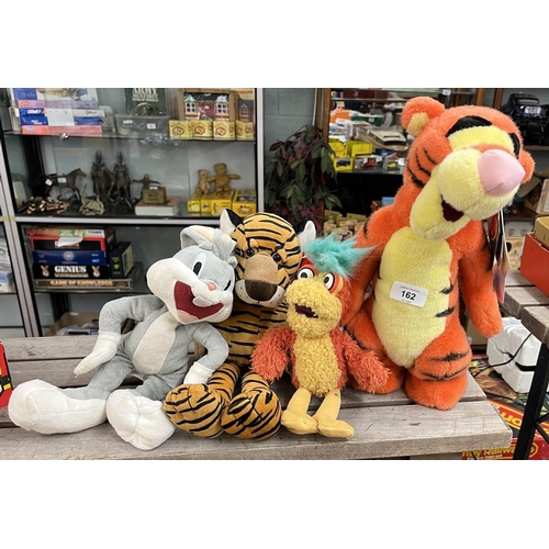 162 - Collection of soft toys to include musical Tigger, Bugs Bunny etc