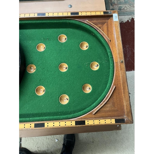 144 - Collection of sporting equipment to include dartboard, bagatelle board etc