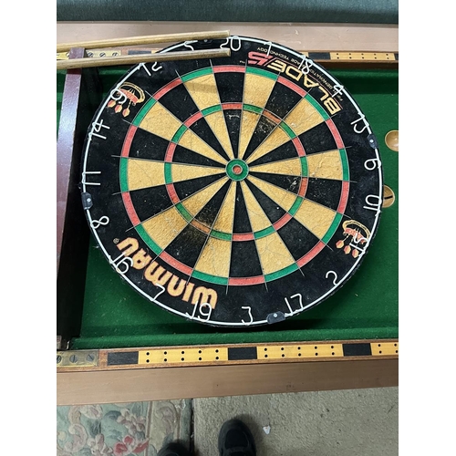 144 - Collection of sporting equipment to include dartboard, bagatelle board etc