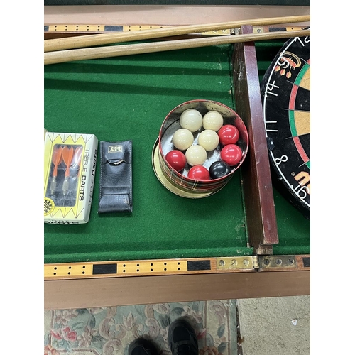 144 - Collection of sporting equipment to include dartboard, bagatelle board etc