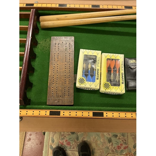 144 - Collection of sporting equipment to include dartboard, bagatelle board etc